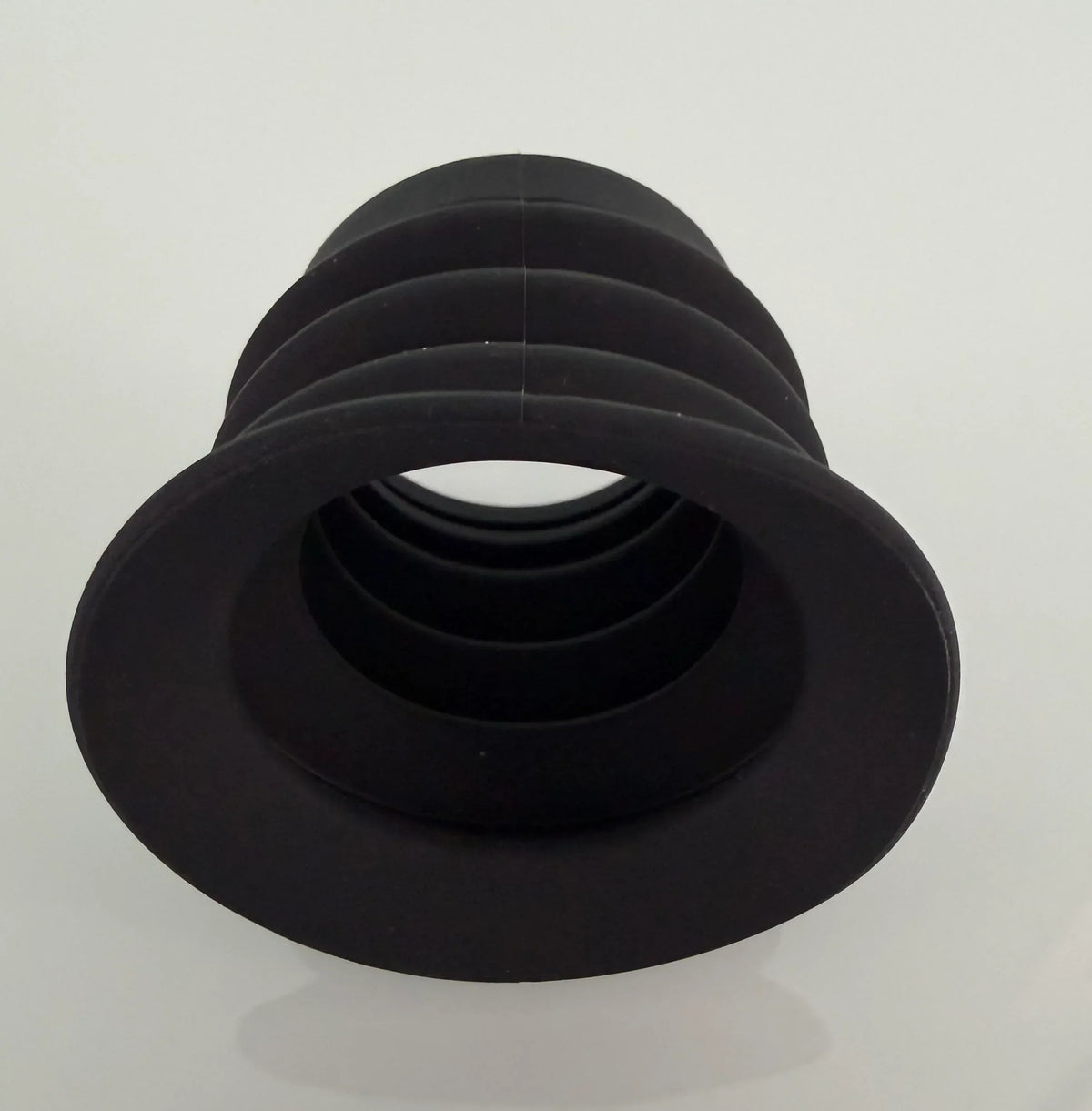 Black rubber bellows-style protective eye cup for night vision optics