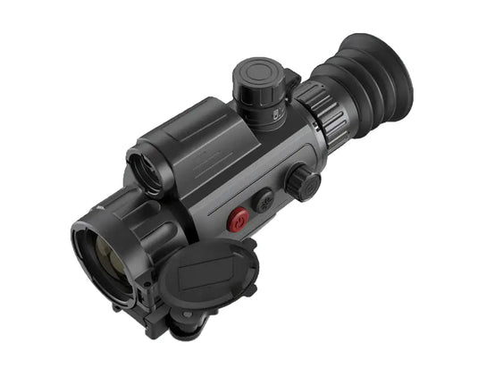 Black night vision weapon sight with rubber eyepiece and control knobs on white background
