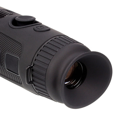 Close-up of black night vision monocular eyepiece with textured rubber grip and control buttons
