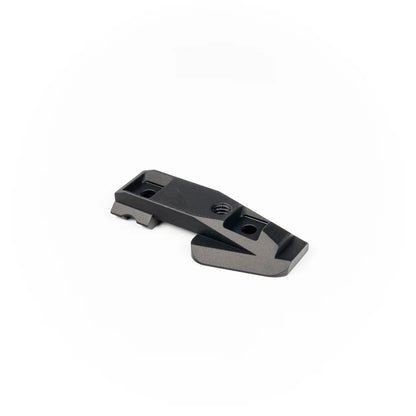 Black night vision optics mounting base on a white background
