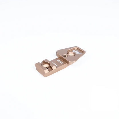 Tan anodized night vision mount adapter with UNV branding on white background